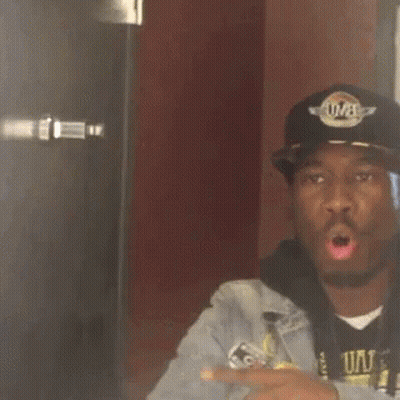 Man With Hat Saying UVA Talking To Another Man GIF