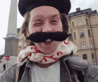 Man With Hat Scarf And Mustache GIF