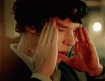 Man With Headache Holding Head GIF