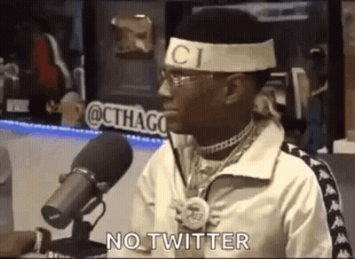 Man With Headband And Glasses Saying No Twitter Into Microphone GIF