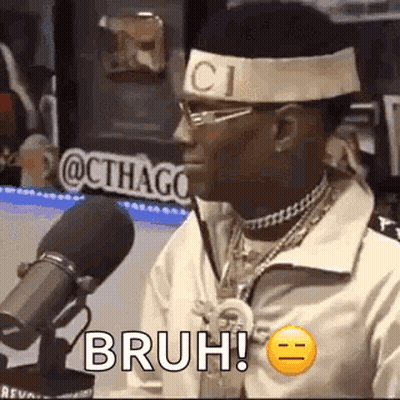 Man With Headband And Glasses Sitting At Microphone GIF