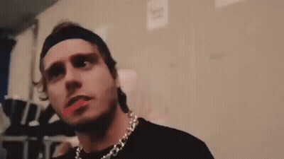 Man With Headband And Necklace Giving Middle Finger GIF