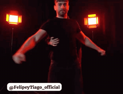 Man With Headband Hugging Another Man In Red Lights GIF