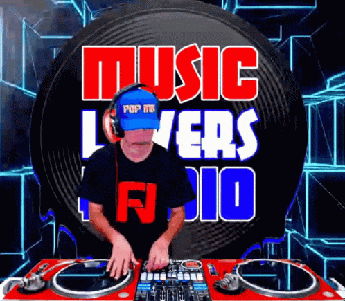 Man With Headphones and Blue Hat Playing Music in Front of Music Lovers Sign