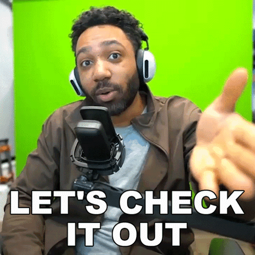 Man With Headphones And Brown Jacket Says Lets Check It Out GIF
