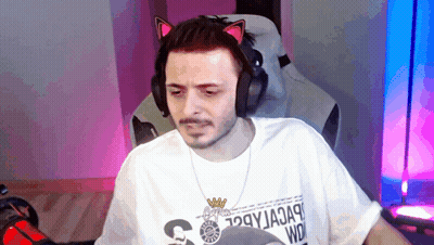 Man With Headphones And Cat Ear Headband Sitting In Chair GIF