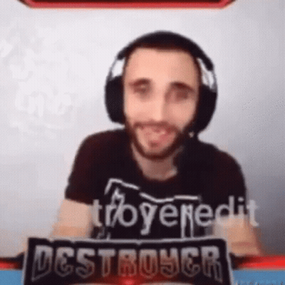 Man with Headphones and Destroyer Sign in Front of Screen