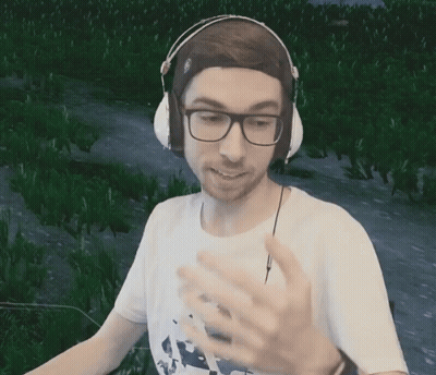 Man With Headphones And Glasses In Green Field GIF