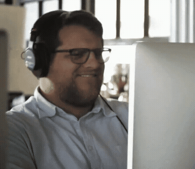 Man With Headphones And Glasses Looking At Computer GIF