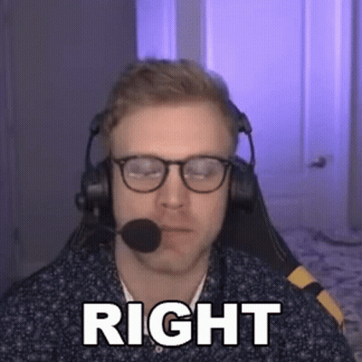 Man With Headphones and Glasses Saying Right Into Microphone