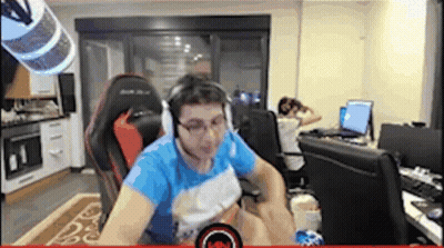 Man With Headphones And Glasses Sitting In Chair GIF