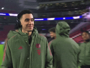 Man With Headphones And Green Jacket Smiling GIF