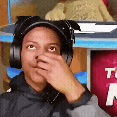 Man With Headphones And Hat Covering Nose GIF