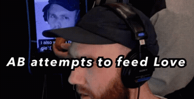 Man With Headphones And Hat Feeding Love GIF