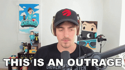 Man With Headphones And Hat Says Outrage GIF