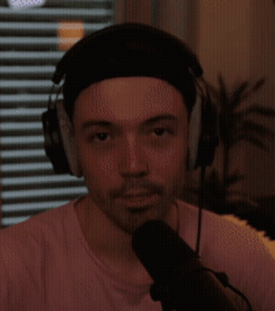 Man With Headphones And Headband Speaking Into Microphone GIF