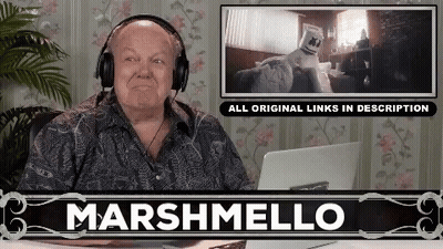 Man With Headphones And Marshmallow On Head At Desk GIF