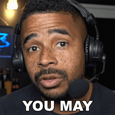 Man With Headphones and Microphone Saying You May