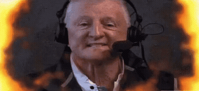 Man With Headphones And Microphone Surrounded By Flames GIF