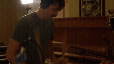 Man With Headphones And Mustache Playing Piano GIF