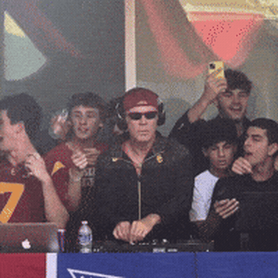 Man With Headphones And Sunglasses In Front Of Crowd GIF