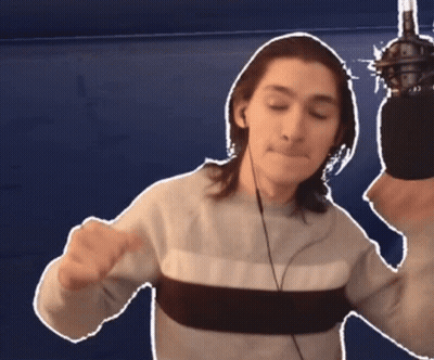 Man With Headphones And Sweater Holding Microphone GIF