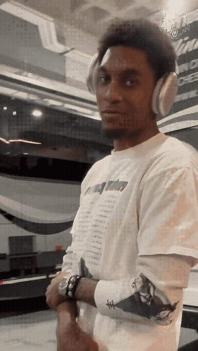 Man With Headphones And T-Shirt Saying A Few Dollars GIF