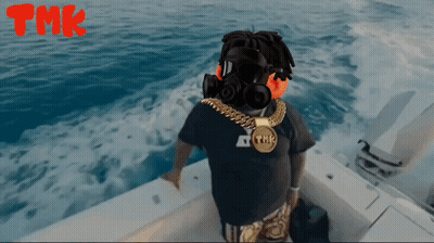 Man With Headphones And TMK Necklace On Boat GIF