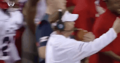 Man With Headphones And White Hat In Front Of Crowd GIF