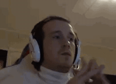 Man With Headphones And White Turtleneck Listening To Music GIF