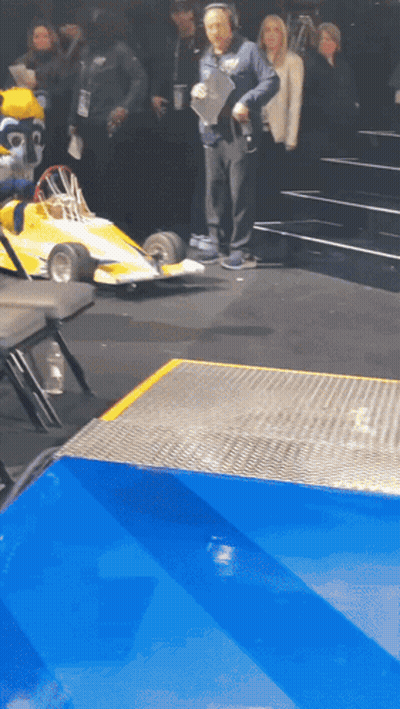 Man With Headphones And Yellow Race Car GIF