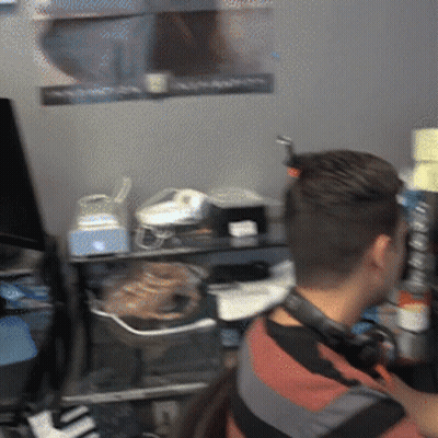 Man With Headphones At Computer Desk GIF