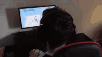 Man With Headphones At Computer GIF