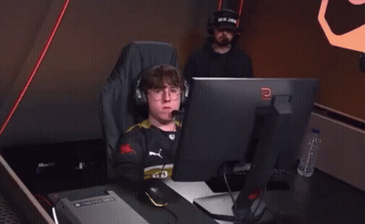Man With Headphones At Computer With Letter E GIF