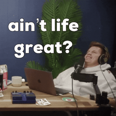 Man With Headphones At Desk Laptop Saying Ain't Life Great GIF