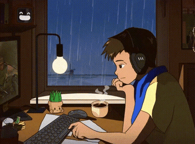Man With Headphones At Desk With Computer And Coffee GIF