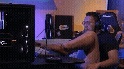 Man With Headphones At GSkill Computer Desk GIF