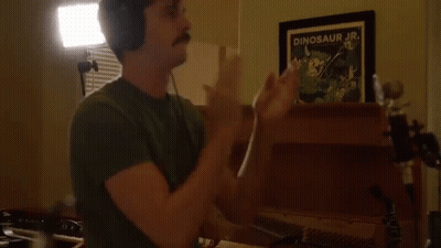 Man With Headphones Clapping In Front Of Dinosaur Jr. Picture GIF