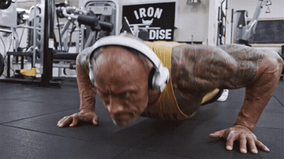 Man With Headphones Doing Push Ups Iron Dise Sign GIF