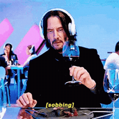 Man With Headphones Eating And Drinking Wine GIF