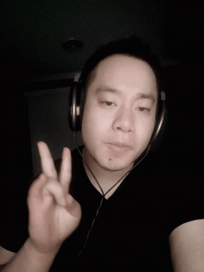 Man With Headphones Giving Peace Sign GIF