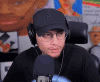 Man With Headphones Hat And Glasses At Microphone GIF