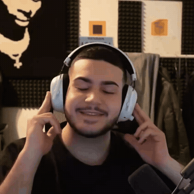Man With Headphones Holding Comb GIF