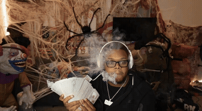 Man With Headphones Holding Money GIF