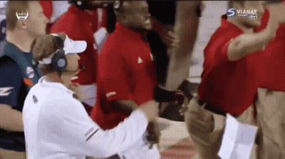Man With Headphones In Front Of Group And Viasat Sport Sign GIF