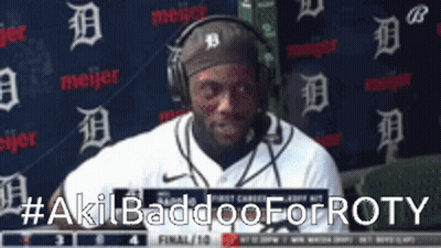 Man With Headphones In Front Of Meijer Wall GIF