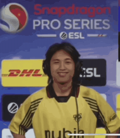Man With Headphones In Front Of Snapdragon Pro Series Banner GIF