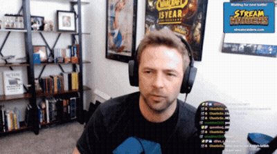 Man With Headphones In Front Of Stream Hader Sign GIF
