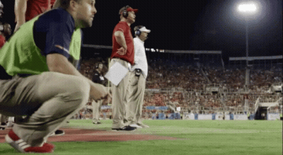 Man With Headphones In Front Of Viasat Sport Sign GIF