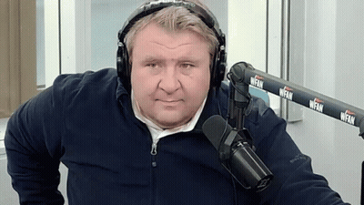 Man With Headphones In Front Of WFAN Microphone GIF